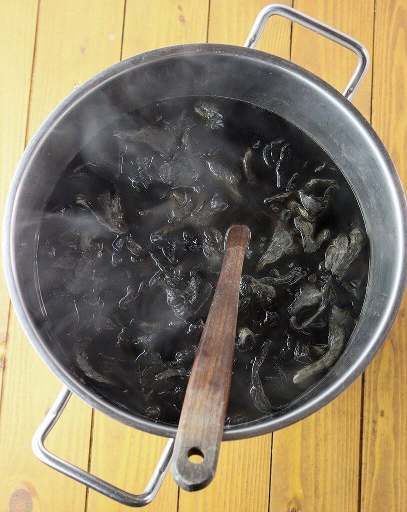 image of boiling black trumpet mushrooms